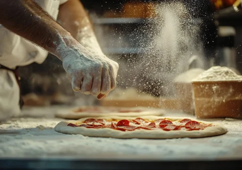 person-is-making-pizza-with-pizza-cutter copia 2